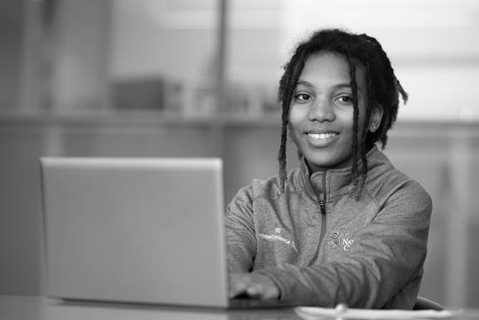 NCH worker on a laptop