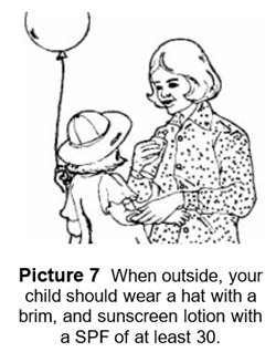 child wearing a hat and sunscreen while outside