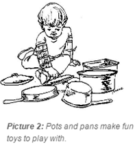 Baby playing with pots and pans