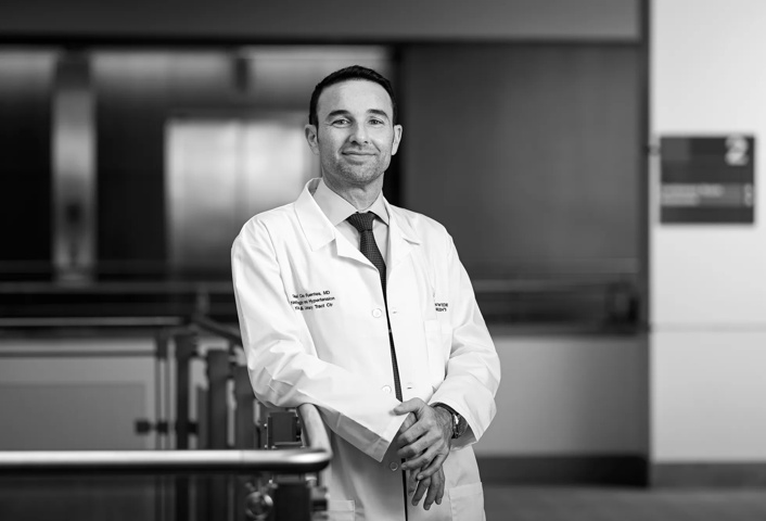 Gabriel Cara Fuentes, MD, PhD, standing in the hallway of a research building at Nationwide Children's Hospital