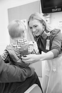doctor listening to a patient's lungs