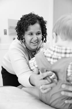 doctor with a patient that looks to be a toddler