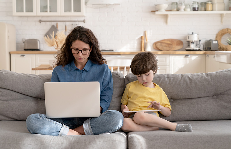 Mother sitting with child seeking an online second opinion