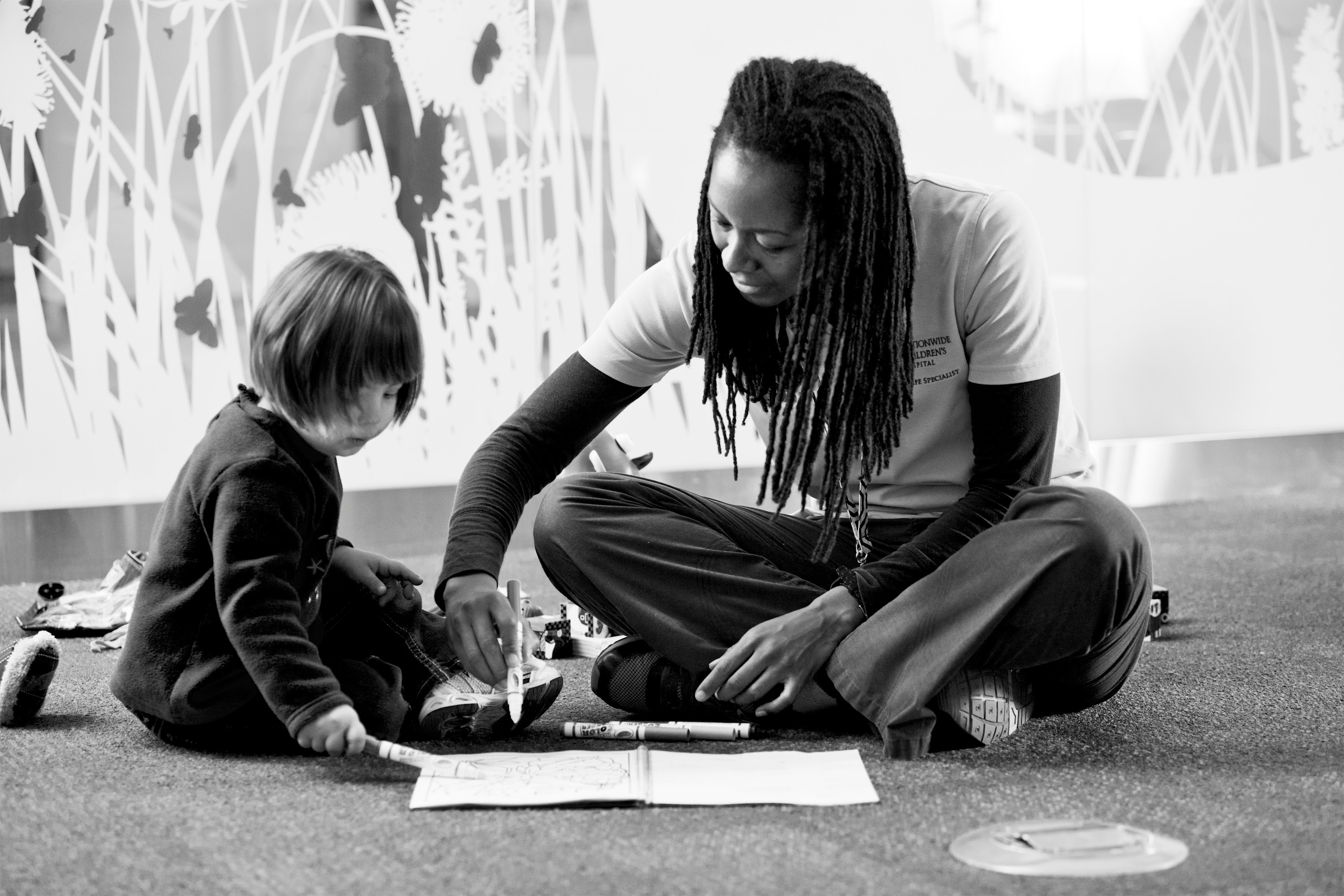 Child Life Specialist Playing With Young Girl